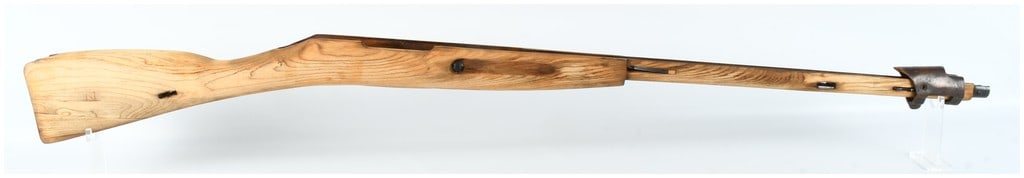 One Mosin Nagant Rifle Stock in Elm Wood: One rifle stock for a Mosin Nagant pattern rifle, manufactured from light-colored wood featuring a prominent, wide grain pattern characteristic of elm. This component features recessed finger grooves 