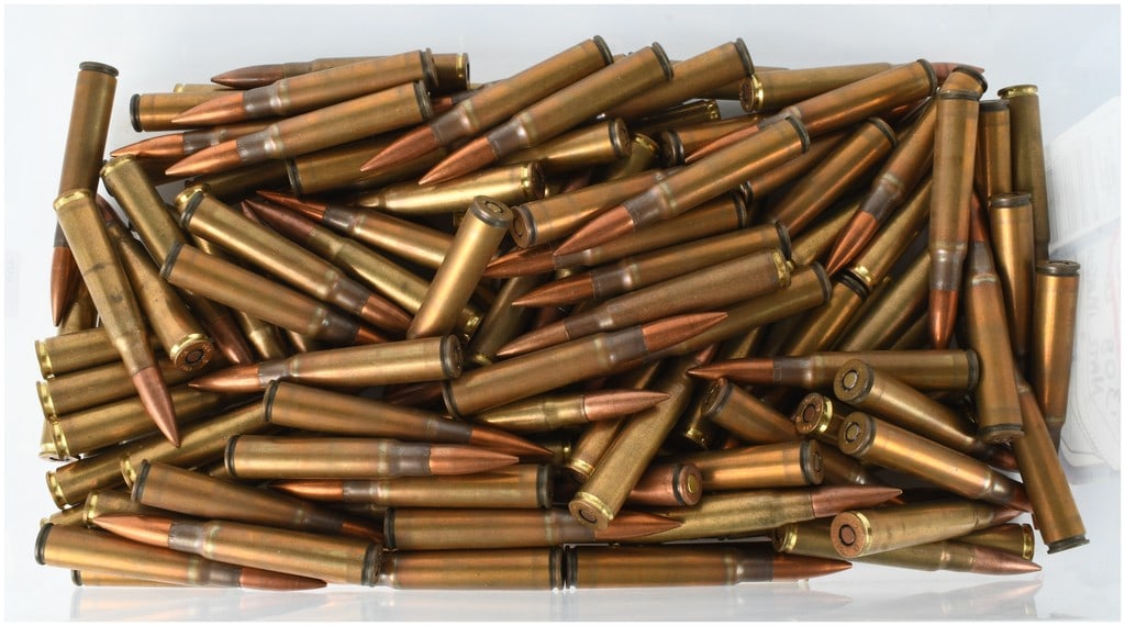 A Lot of 118 Rounds of 8mm Mauser Ammunition: This lot contains 118 rounds of 8mm Mauser (7.92x57mm) military surplus ammunition featuring brass cases and copper-jacketed spitzer-type full metal jacket (FMJ) bullets. The collection displays a ran