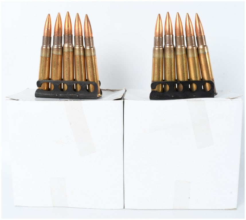 A Lot of 85 Rounds Hirtenberger Patronenfabrik .303 British Rifle Ammunition on Clips .303 British: This lot comprises 85 rounds of .303 British rifle ammunition mounted on ten black-finished steel five-round charger clips. The ammunition features copper-jacketed spitzer bullets and brass casings th