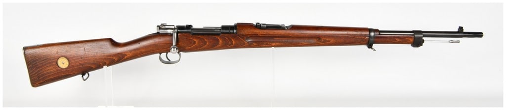 Husqvarna Vapenfabriks Aktiebolag Model 38 Bolt Action Rifle 6.5x55mm with 24 Inch Barrel 1941: This is a Swedish Model 38 bolt-action rifle chambered in 6.5x55mm, a pattern specifically produced by Husqvarna as a shorter, handier alternative to the earlier Model 96 long rifle. The firearm featu