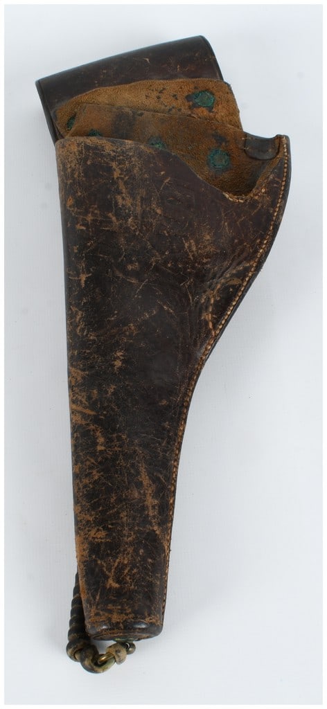 Antique US Army Leather Revolver Holster with Braided Lanyard: A single US Army leather holster designed for a large-frame revolver, typical of the equipment issued during the late 19th-century Indian Wars and Spanish-American War periods. The holster is construc