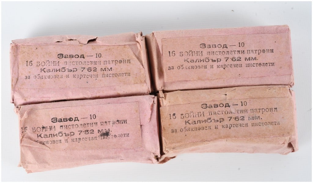 A Lot of 64 Rounds of Arsenal Factory 10 7.62x25mm Tokarev Ammunition: This lot consists of a total of 64 rounds of Bulgarian military surplus ammunition, partitioned into four original paper-wrapped boxes each containing 16 rounds. The ammunition is chambered in 7.62x25