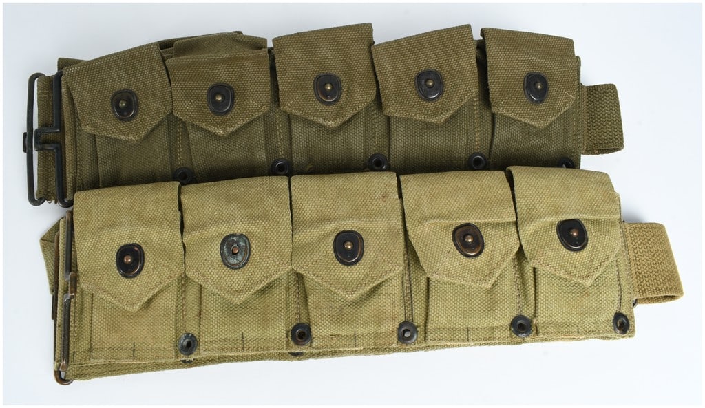 Two Original WWII US M1923 M1 Garand Cartridge Belts, Army and USMC: This lot contains two original United States military M1923 ten-pocket cartridge belts, designed for carrying eight-round clips for the M1 Garand rifle. The first belt is a US Army issue in Olive Drab