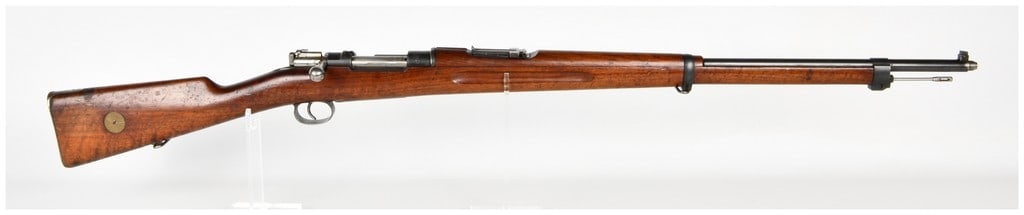 Carl Gustafs Stads Gevärsfaktori Model 1896 Bolt Action Rifle 6.5x55mm with 29 Inch Barrel 1909: This is a Swedish military Model 1896 bolt-action rifle chambered in 6.5x55mm Swedish, manufactured by Carl Gustafs Stads Gevärsfaktori in 1909. The rifle is equipped with a blued steel barrel measur