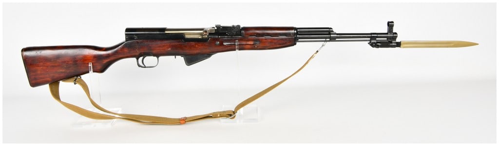 Tula Arsenal SKS-45 Semi-Automatic Rifle 7.62x39mm with 20 Inch Barrel 1954: This Russian Tula Arsenal SKS-45 is a semi-automatic rifle chambered in 7.62x39mm, configured for military service. It features a 20 inch barrel equipped with an integral folding blade bayonet that ex