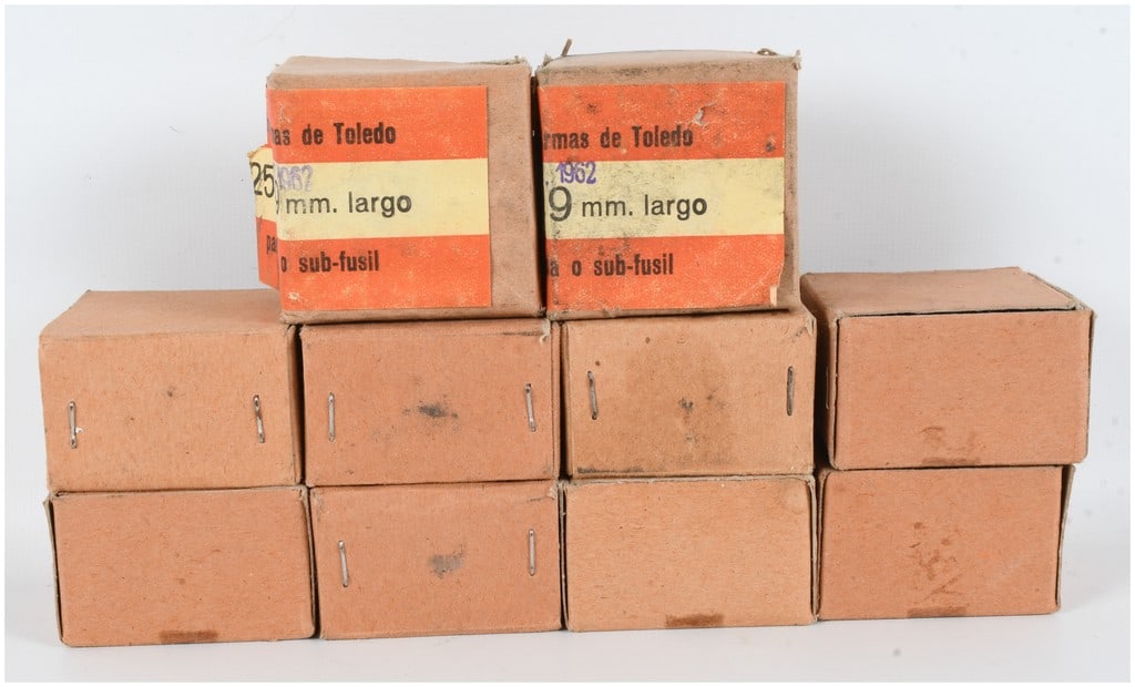 A Lot of 250 Rounds of Fábrica Nacional de Armas de Toledo 9mm Largo Ammunition 1962: This lot comprises 250 rounds of 9mm Largo ammunition produced by the Fábrica Nacional de Armas de Toledo in Spain. The ammunition is distributed across ten individual cardboard boxes, each originall