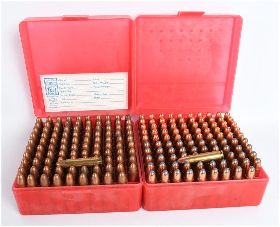 A Lot of 200 Rounds of Remanufactured .30 Carbine Ammunition: This lot consists of 200 rounds of remanufactured .30 Carbine ammunition contained within two red plastic ammunition boxes. The ammunition features brass cases and a variety of projectile types includ