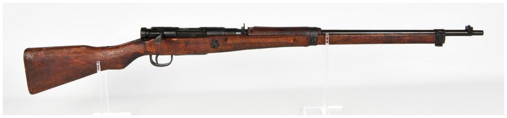 Nagoya Arsenal Arisaka Type 99 Last Ditch Bolt Action Rifle 7.7x58mm: This is a Japanese Arisaka Type 99 bolt-action short rifle chambered in 7.7x58mm, manufactured at the Nagoya Arsenal. This specimen represents the Substitute Standard or Last Ditch configuration produ