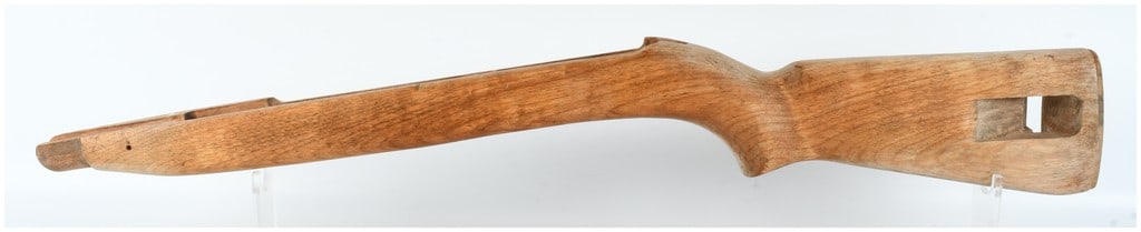 A US Military M1 Carbine Low-Wood Hardwood Stock: This is a single hardwood stock for a US Military M1 Carbine (.30 caliber). The item is a low-wood variant, which is identified by the reduced wood profile along the operating rod channel on the right