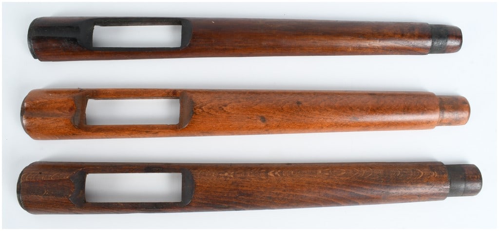 Three Military Rifle Handguards, possibly for Mauser Model 1893 or Krag Patterns: A trio of walnut wood rifle handguards of the pattern typically used on late 19th and early 20th-century military rifles, such as the Mauser Model 1893 or U.S. Krag-Jorgensen. Each piece is crafted fr