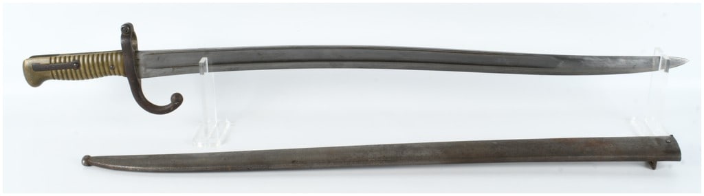 French Model 1866 Chassepot Sword Bayonet and Scabbard, Saint-Etienne, 1871: A French Model 1866 Chassepot sword bayonet and matching scabbard. This example was manufactured at the Manufacture d Armes de Saint-Etienne in November 1871. The bayonet features a single-edged