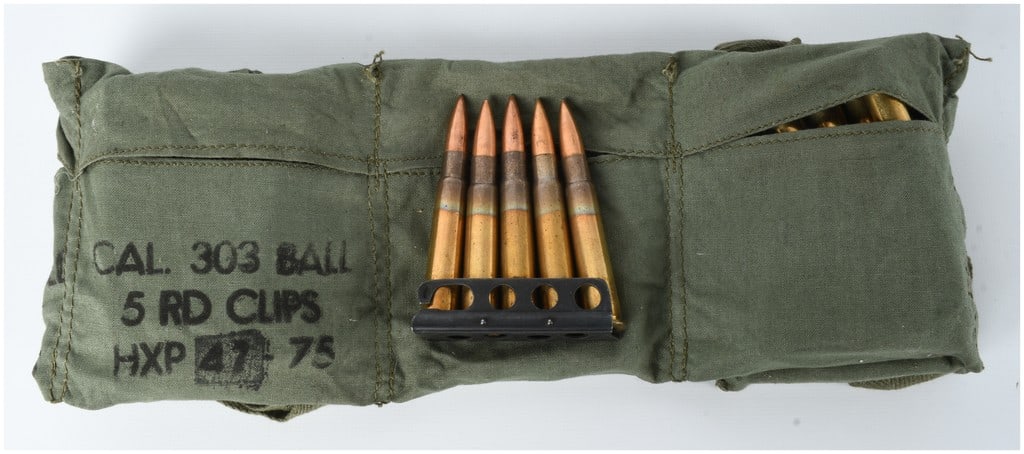 A Lot of 50 Rounds of HXP .303 British Ball Ammunition: This lot consists of fifty rounds of .303 British caliber ball ammunition produced by the Greek Powder and Cartridge Company. The ammunition is mounted on ten black metal five-round stripper clips and
