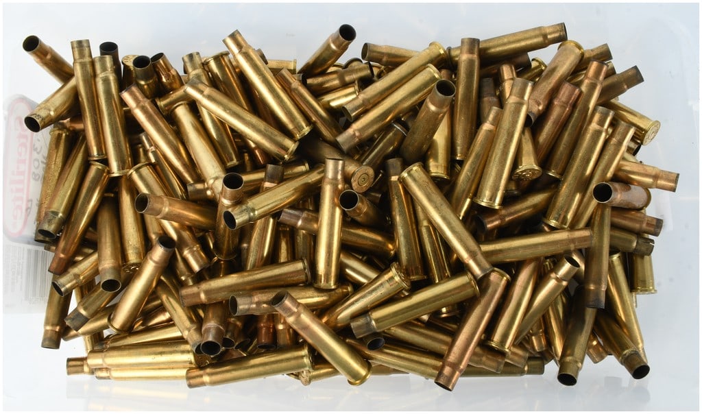 A Lot of 234 Empty .303 British Brass Casings for Reloading: This lot consists of 234 empty brass ammunition cartridge cases chambered for .303 British, suitable for reloading. The collection contains spent, necked, and rimmed casings from various manufacturers
