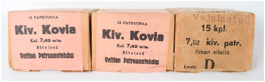 A Lot of 44 Rounds of Finnish Valtion Patruunatehdas 7.62x54mmR Rifle Ammunition: This lot consists of a total of 44 rounds of Finnish 7.62x54mmR rifle ammunition, also known as 7.62x53R, manufactured by the State Cartridge Factory. The collection includes three vintage cardboard s