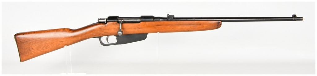 Italian Carcano Model 1938 Bolt Action Short Rifle 7.35x51mm 1939: This is an Italian Carcano Model 1938 bolt-action short rifle chambered in 7.35x51mm Carcano, presented in a sporterized configuration. The rifle features an integral box magazine designed for six-rou