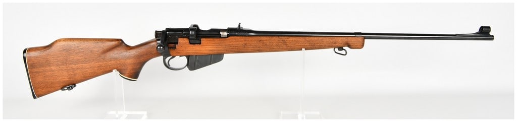 BSA No. 1 Mk III* Sporterized Bolt Action Rifle .303 British with Sporterized Barrel 1942: This is a sporterized bolt-action rifle built on a British Lee-Enfield No. 1 Mk III* action chambered in .303 British. The rifle features a shortened barrel with a blued finish and has been fitted wit