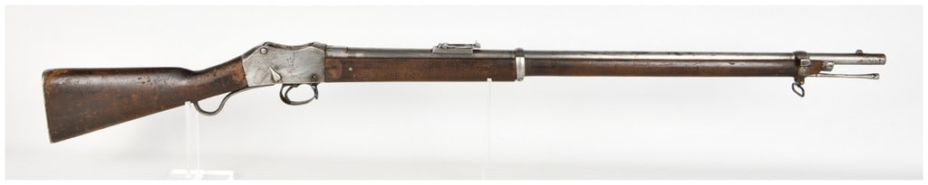 Enfield Martini-Henry Mark II Lever Action Rifle .577/450 with 33 Inch Barrel Antique: This is a single-shot lever-action Martini-Henry Mark II rifle chambered in .577/450 caliber. It features a 33-inch barrel equipped with a fixed front blade sight and a rear flip-up ladder sight gradu