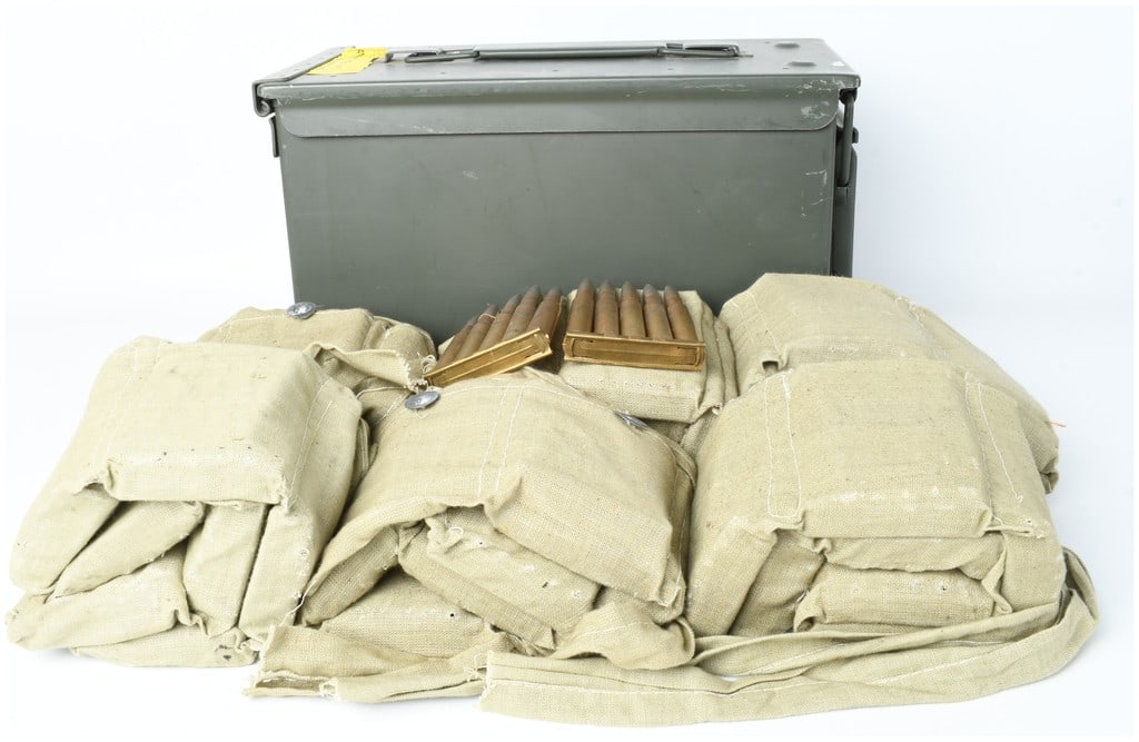 A Lot of 295 Rounds of Turkish 8mm Mauser Ball Ammunition: This lot includes 295 rounds of 8mm ball ammunition, specifically 7.92x57mm Mauser cartridges featuring silver-toned cupronickel-jacketed projectiles and brass cases. The ammunition is organized onto 