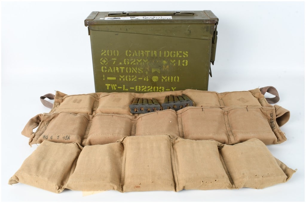 150 Rounds of .303 British Ammunition on Stripper Clips with Canvas Bandoliers and US M19A1: This lot consists of 150 rounds of .303 British centerfire rifle ammunition mounted on steel stripper clips, accompanied by three canvas bandoliers and a US military ammunition storage can. The cartri