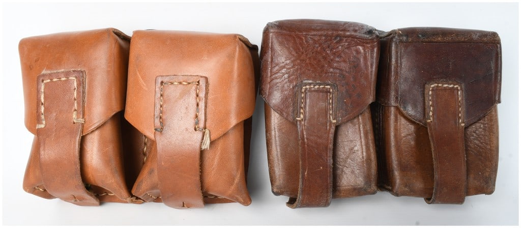 A Pair of Leather Double Ammunition Pouches for Mauser Stripper Clips: A pair of leather ammunition pouches designed to hold stripper clips for Mauser-pattern rifles. The items are visually consistent with mid-20th century Yugoslavian or Serbian M48 military equipment. E