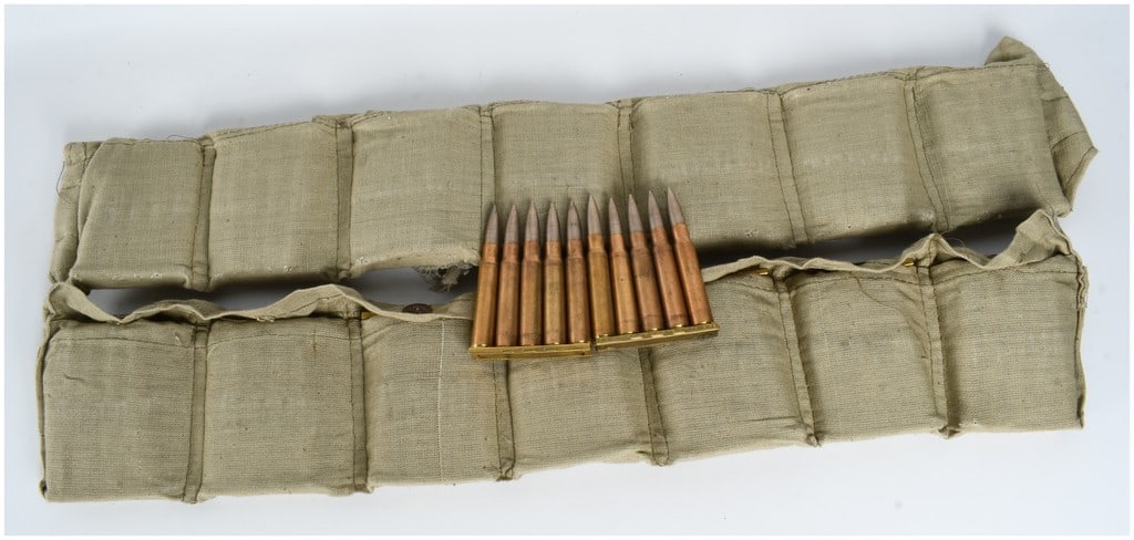 A Lot of 140 Rounds of Turkish Military Surplus 8mm Mauser Ammunition on Stripper Clips: This lot consists of 140 rounds of Turkish military surplus 8mm Mauser ammunition, organized into two khaki cotton canvas bandoliers. Each round is chambered in 7.92x57mm Mauser and features a