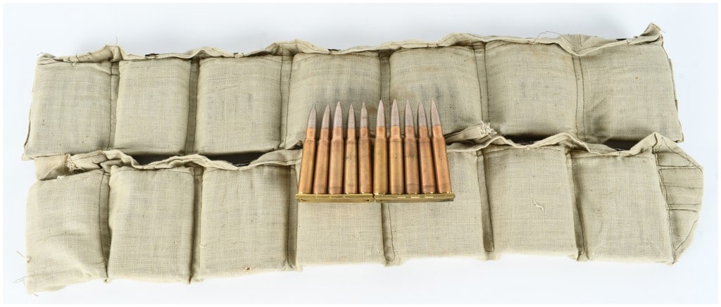 140 Rounds of Turkish 8mm Mauser Ammunition on Stripper Clips in Bandoliers: A collection of 140 rounds of Turkish military surplus 8mm Mauser (7.92x57mm) rifle ammunition. The lot consists of cartridges mounted on brass stripper clips, each holding five rounds, and housed