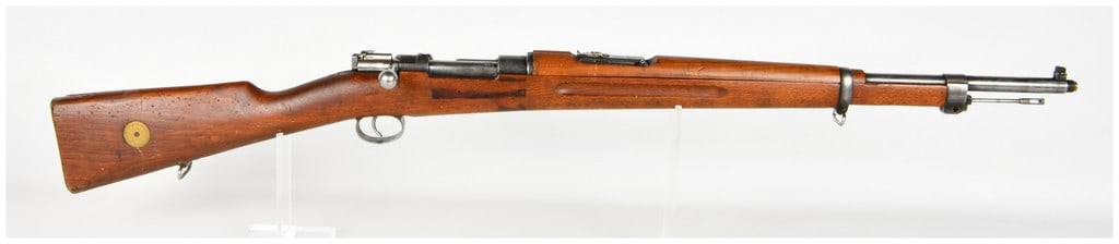 Carl Gustafs Stads Gevarsfaktori Model 1896 Bolt Action Rifle 6.5x55mm with 29 Inch Barrel 1907: This is a single Swedish Mauser Model 1896 bolt-action service rifle chambered in 6.5x55mm. The rifle features a 29-inch barrel with a threaded muzzle designed for a blank-firing adapter, though the t