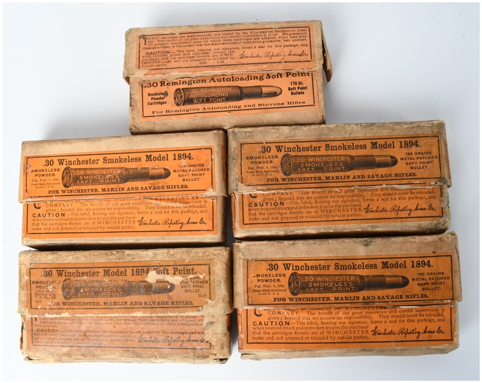 Winchester Repeating Arms Co. Model 1894 and Remington Autoloading Ammunition .30 Caliber with 94: This lot comprises five vintage two-piece cardboard ammunition boxes manufactured by the Winchester Repeating Arms Co., containing a combined total of 94 rounds of centerfire rifle ammunition. The col