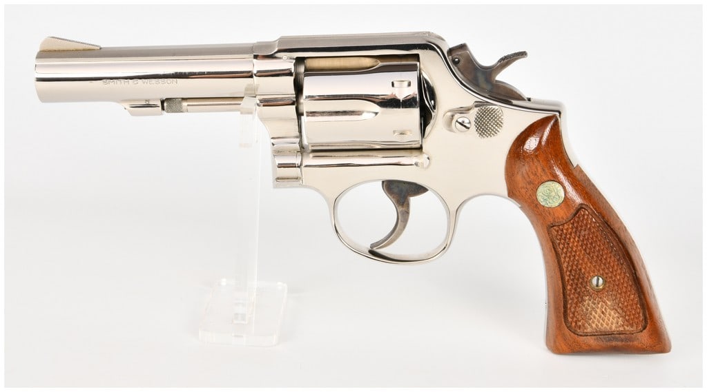 Smith & Wesson Model 13-1 Double-Action Revolver .357 Magnum with 4 Inch Barrel: This is a Smith & Wesson Model 13-1 double-action revolver chambered in .357 Magnum, configured with a 4-inch heavy barrel and a six-shot fluted cylinder. The firearm features a high-polish nickel fin