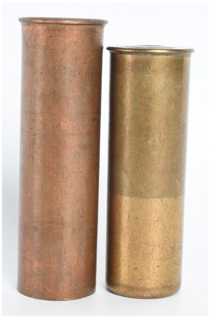 A Pair of Winchester and Geometric Marked All-Metal 12 Gauge Shotgun Shells Antique: This lot consists of a pair of antique all-metal 12 gauge shotgun shells. The first round is constructed with a solid brass casing and is headstamped WINCHESTER No 12. It is loaded with 00 buckshot, a