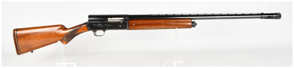 Browning Auto-5 Light Twelve Semi-Automatic Shotgun 12 Gauge with 29.5 Inch Barrel: This Browning Auto-5 Light Twelve is a semi-automatic shotgun chambered for 12-gauge 2 3/4-inch shells. Manufactured in Belgium, it features a blued finish on its scroll-engraved receiver and a ventil
