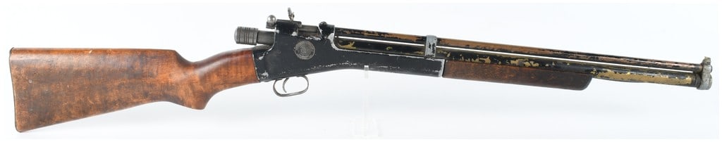 Crosman Arms Company Model 101 Pump-Action Air Rifle .22 Caliber: This Crosman Arms Company Model 101 is a pneumatic pump-action air rifle chambered in .22 caliber. It features a single-shot bolt-action design with a rear pull-knob cocking mechanism and a wooden for