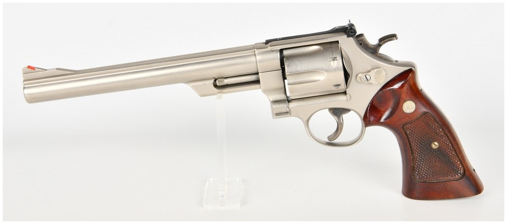 Smith & Wesson Model 29-2 Double Action Revolver .44 Magnum with 8 3/8 Inch Barrel: This is a Smith & Wesson Model 29-2 double-action revolver chambered in .44 Magnum, featuring a factory nickel finish and an 8 3/8-inch pinned barrel with a micro-groove top rib. The firearm is equipp