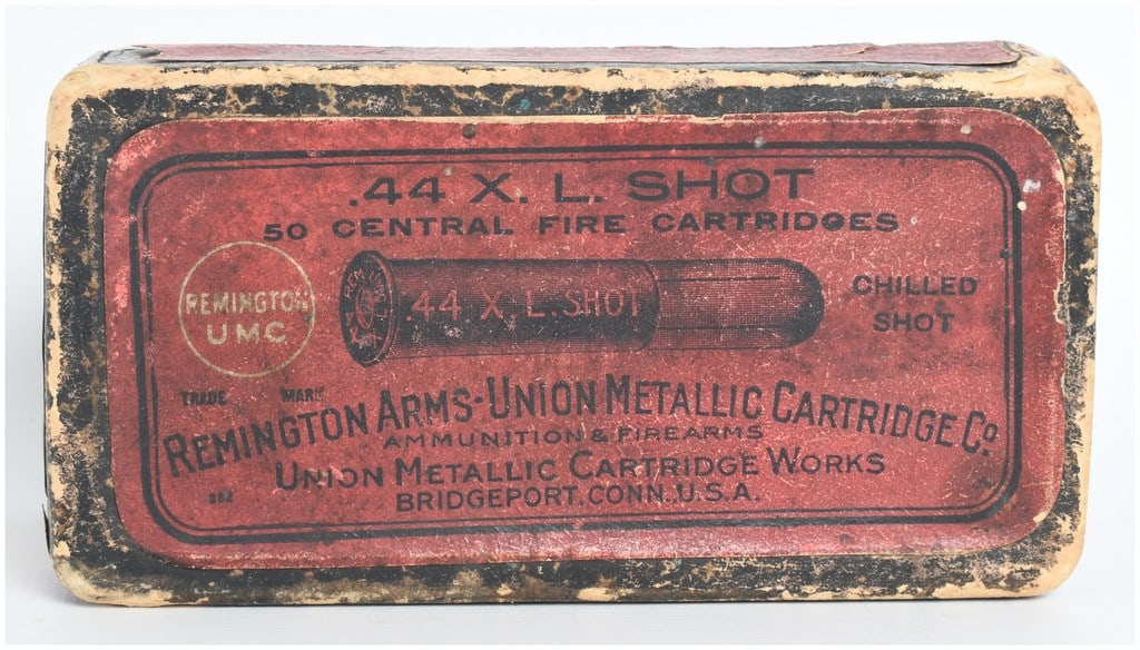 A Lot of 6 Remington UMC .44 X.L. Shot Cartridges with Original Box: This lot consists of six individual .44 X.L. Shot cartridges produced by the Remington Arms-Union Metallic Cartridge Company, housed within their original two-piece red and black cardboard packaging. 