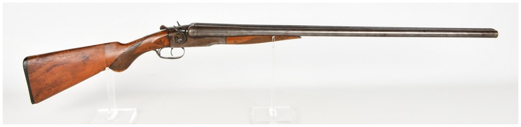 J. Stevens Arms and Tool Company Model 225 Double Barrel Side by Side Hammer Shotgun 12 Gauge: This is a J. Stevens Arms and Tool Company Model 225 double-barrel side-by-side hammer shotgun chambered in 12 gauge, originally intended for general field use. The firearm features a break-action des