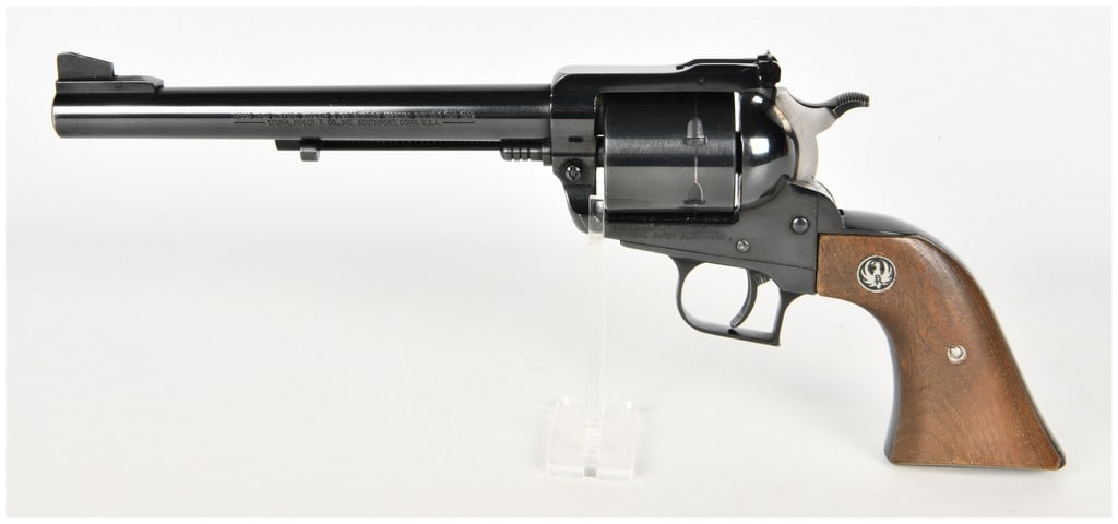 Ruger New Model Super Blackhawk Single Action Revolver .44 Magnum with 7.5 Inch Barrel: This Ruger New Model Super Blackhawk is a single-action revolver chambered in .44 Magnum and configured with a 7.5-inch barrel. The firearm features a high-polish blued finish on the frame, barrel, an