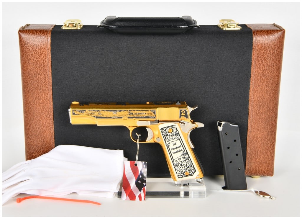 Auto-Ordnance 1911 Semi-Automatic Pistol .45 ACP with 5 Inch Barrel: This is a cased Auto-Ordnance 1911-style semi-automatic pistol chambered in .45 ACP, part of a limited commemorative series for the Second Amendment Foundation. The firearm features a standard 5 inch 