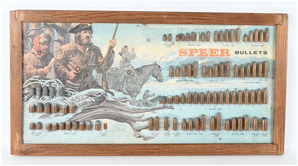 Speer Bullets Lewis and Clark Promotional Ammunition Display Board with 88 Projectiles: This vintage Speer Bullets promotional ammunition display board features a collection of 88 projectiles mounted on a decorative lithographed backdrop depicting the Lewis and Clark expedition in a wint