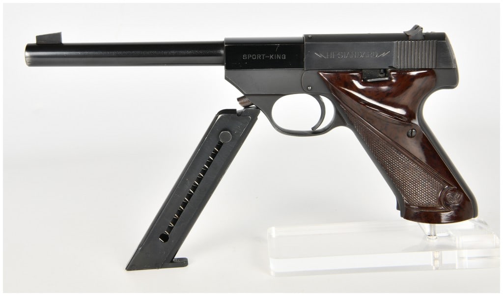 High Standard SK-100 Sport King Semi-Automatic Pistol .22 LR with 6.75 Inch Barrel: This High Standard SK-100 Sport King is a semi-automatic target pistol chambered for .22 Long Rifle cartridges. The firearm features a 6.75-inch tapered barrel equipped with a fixed blade front sight 