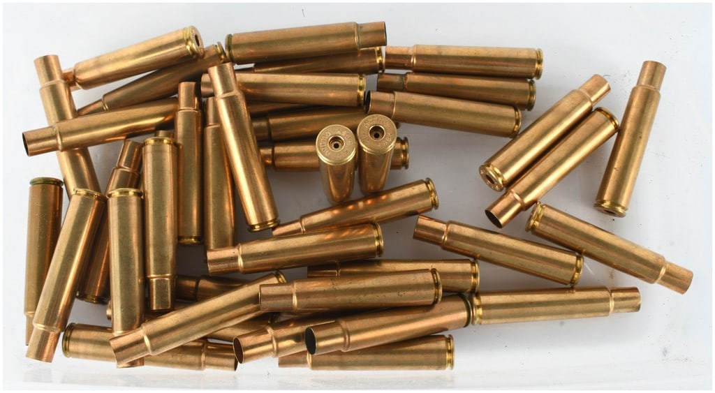 A Lot of 41 Norma .416 Rigby Empty Brass Casings: This lot consists of 41 empty brass ammunition casings for the .416 Rigby caliber manufactured by Norma. These are spent casings intended for reloading and do not contain any primers, propellant, or p