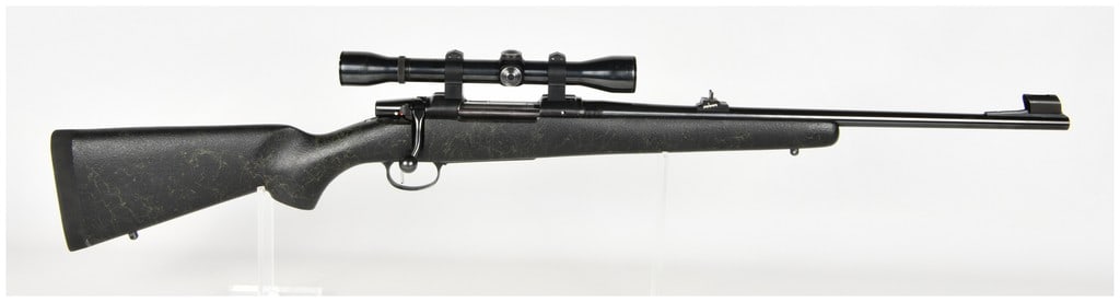 CZ 550 Medium Bolt Action Rifle 9.3x62: This CZ 550 Medium bolt-action rifle is chambered in 9.3x62mm and is configured for big game hunting. The firearm features a blued steel barrel and receiver, with the barrel marked 1:14" CAL. 9.3x62 a