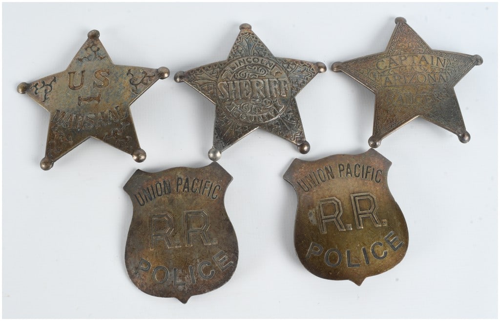A Collection of Five Vintage Style Law Enforcement and Railroad Badges: This lot consists of five law enforcement badges designed in the style of the 19th-century American West and early 20th-century railroad security. The group includes three five-pointed star badges wit