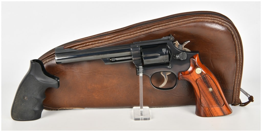 Smith & Wesson Model 19-4 Double Action Revolver .357 Magnum with 6 Inch Barrel: This Smith & Wesson Model 19-4 is a double-action revolver chambered for the .357 Magnum cartridge and featuring a six-round capacity cylinder. The firearm is equipped with a 6-inch barrel and display