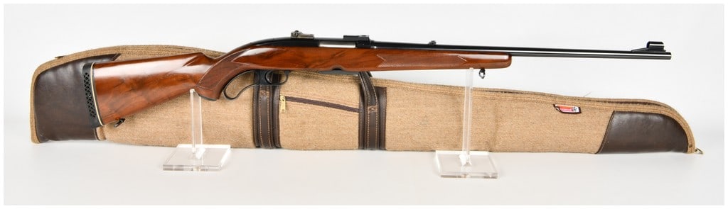 Winchester Model 88 Lever Action Rifle .284 Winchester with 22 Inch Barrel: This Winchester Model 88 is a lever-action rifle chambered in .284 Winchester, featuring a 22 inch barrel. The rifle is constructed with a blued steel finish on both the barrel and receiver, providing
