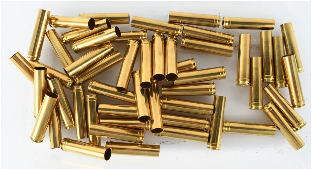 A Lot of 108 Hornady and Weatherby Empty Brass Casings in .450 Marlin and 7mm Weatherby Magnum: This lot consists of a collection of 108 spent brass cartridge cases intended for reloading, divided into two distinct calibers. The first group comprises 50 belted, straight-walled cases with headsta