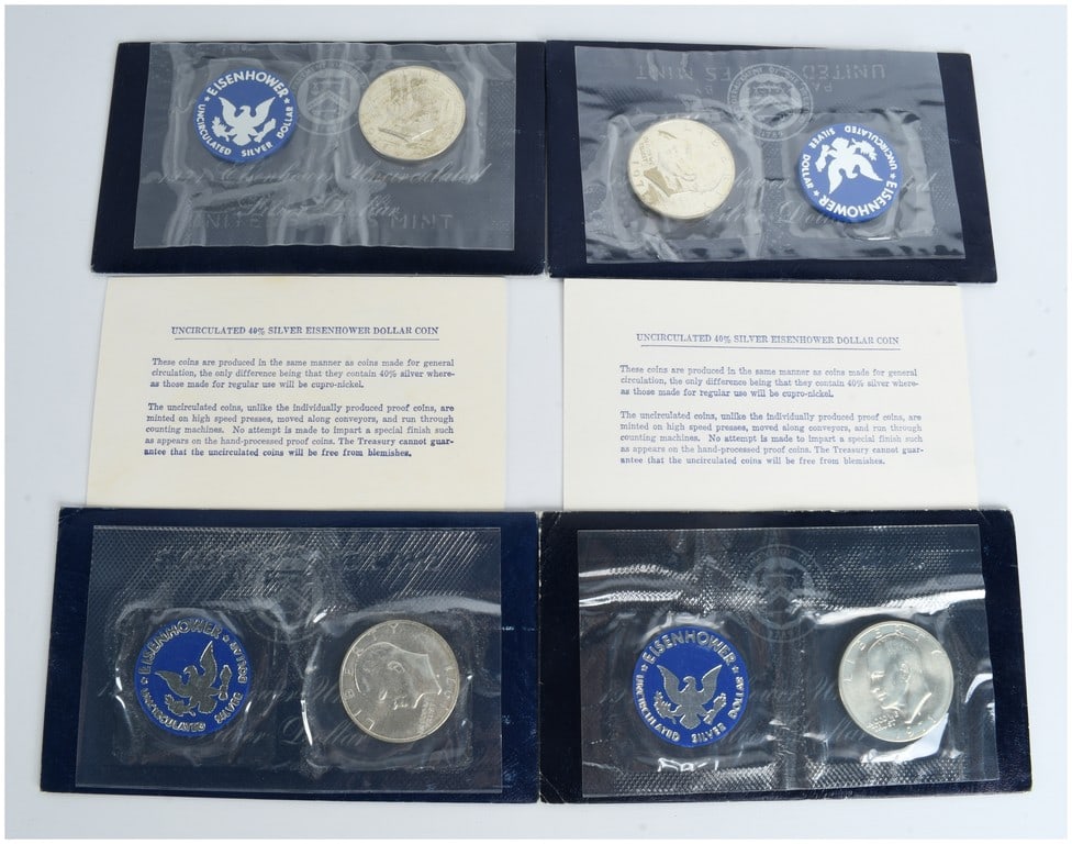 Four US 1971-S Eisenhower Uncirculated 40% Silver Dollars in Original Mint Packaging: This lot consists of four 1971-S Eisenhower silver dollars, struck at the San Francisco Mint in a 40% silver composition. These specimens are known as Blue Ikes due to their original US Treasury packa