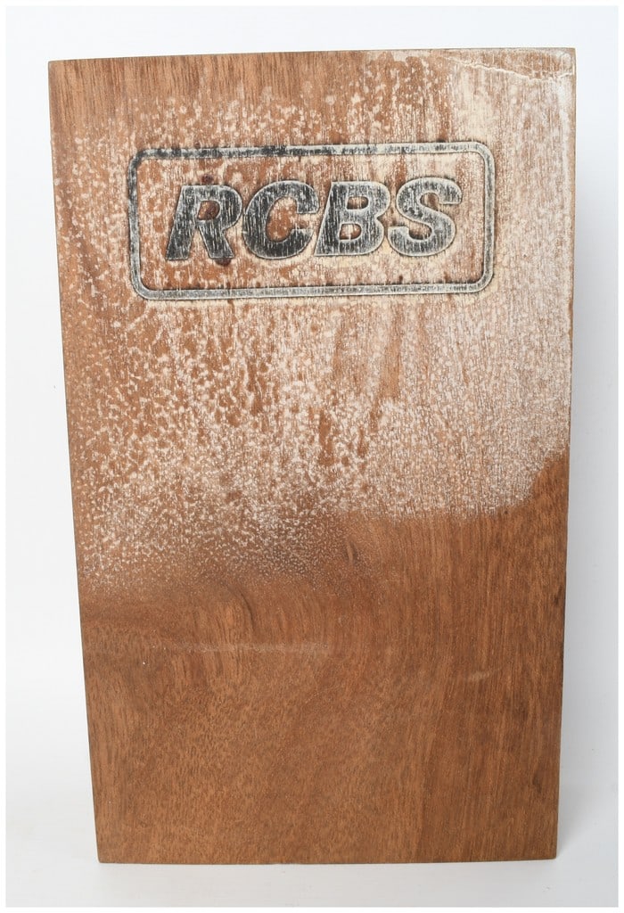 RCBS Competition 7mm Magnum Reloading Die Set in Hardwood Case: A vintage RCBS Competition reloading die set for 7mm Remington Magnum caliber ammunition. The set is housed in a custom-milled hardwood presentation box with a hinged lid. The collection includes one 