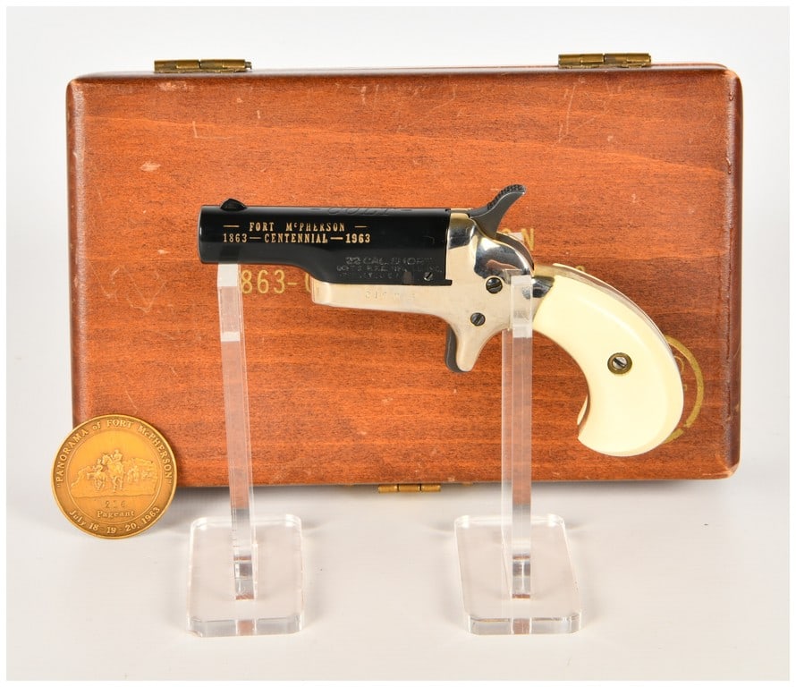 Colt Fourth Model Single Shot Derringer .22 Short with 2.5 Inch Barrel 1963: This is a single Colt Fourth Model Derringer, a commemorative single-shot pistol chambered in .22 caliber short. The barrel features a high-polish black finish with gold-filled engravings on the left 