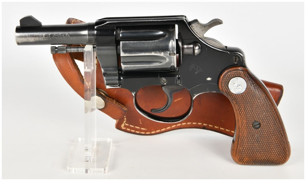 Colt Cobra Double-Action Revolver .38 Special with 4 Inch Barrel: This lot consists of a single Colt Cobra double-action revolver chambered for the .38 Special cartridge. The firearm is configured with a 4 inch barrel featuring a fixed blade front sight and a square