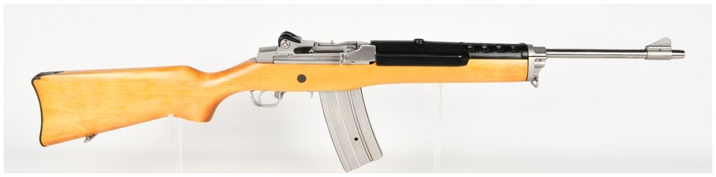 Sturm, Ruger & Co. Mini-14 Semi-Automatic Rifle .223 Remington with 18.5 Inch Barrel: This Sturm, Ruger & Co. Mini-14 is a semi-automatic rifle chambered in .223 Remington, configured as a classic utility carbine. The firearm features an 18.5-inch stainless steel barrel and receiver se